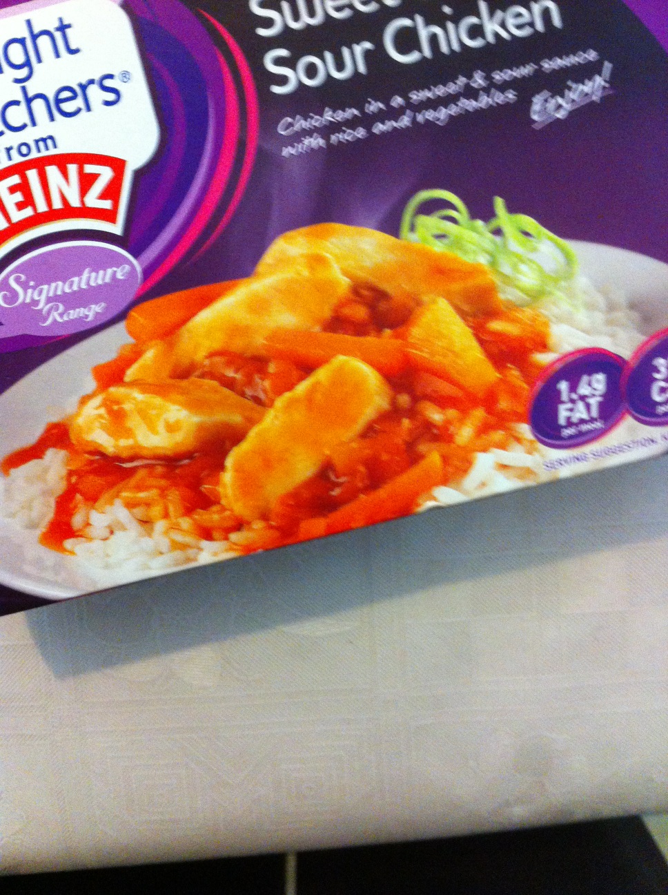 A photo captured by a person who is blind. A computer-generated caption for this photo is: A close up of a plate of food on a table.