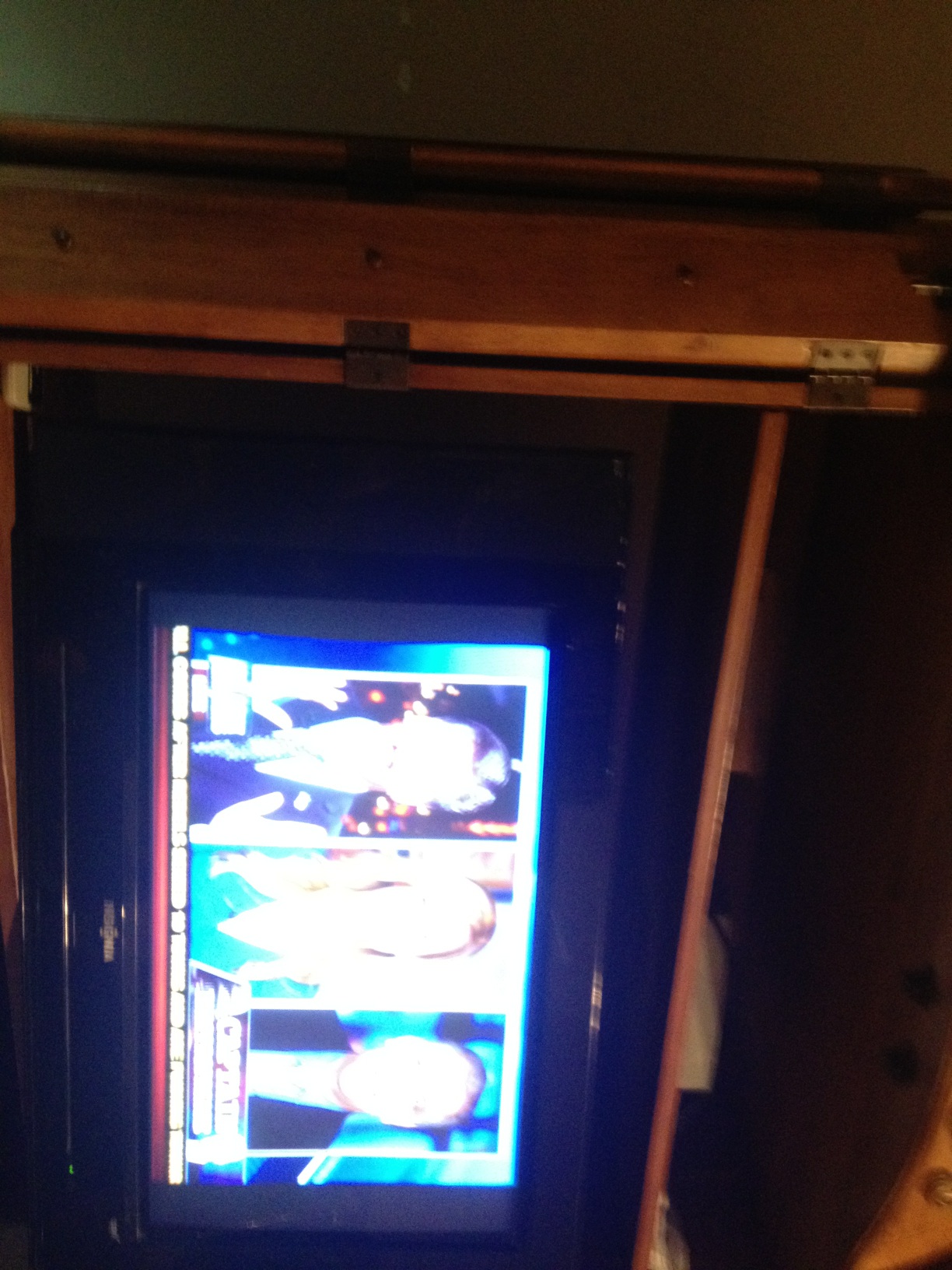A photo captured by a person who is blind. A computer-generated caption for this photo is: There is a television with a tv on it.