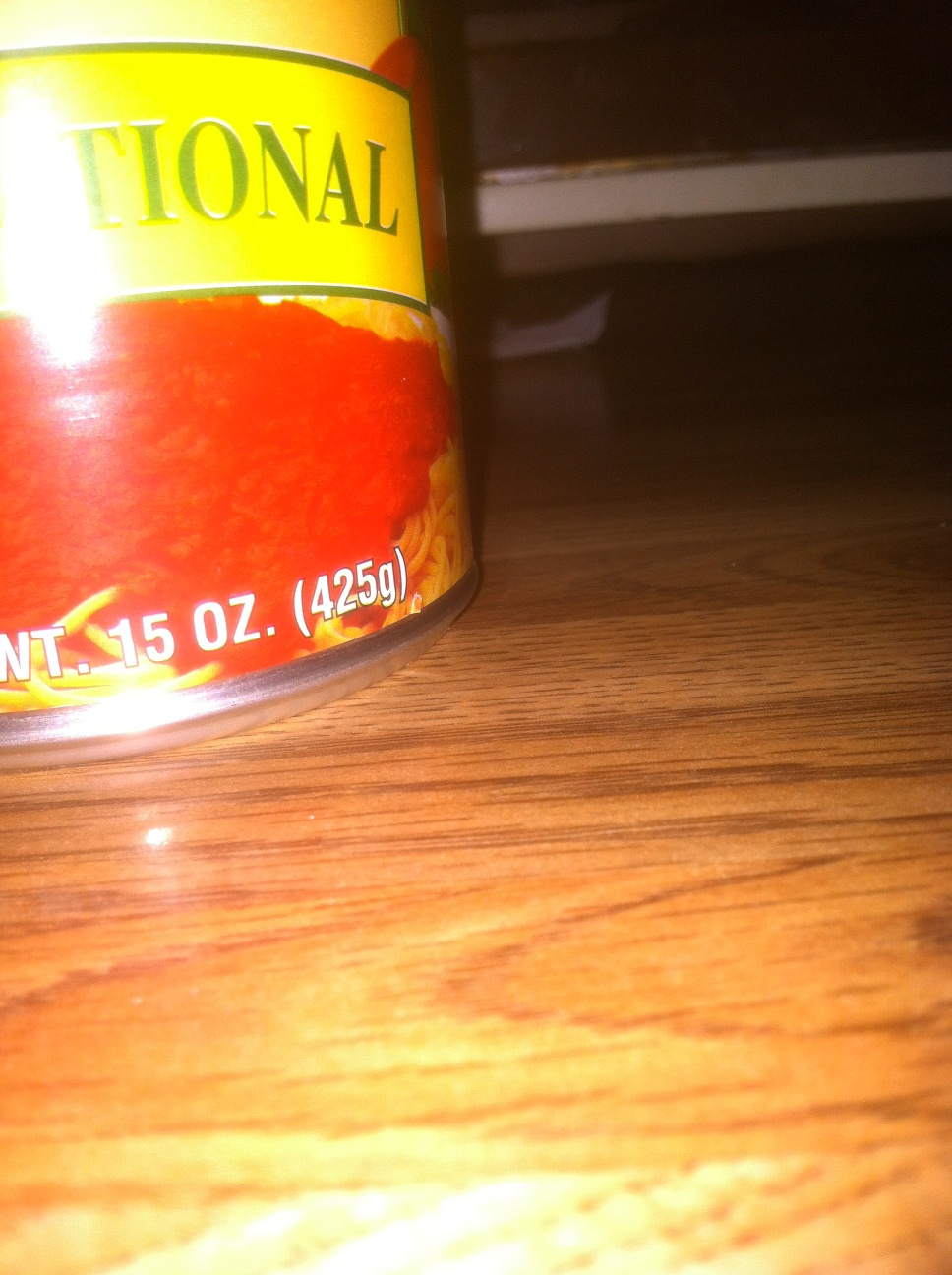 A photo captured by a person who is blind. A computer-generated caption for this photo is: A close up of a bottle of beer.