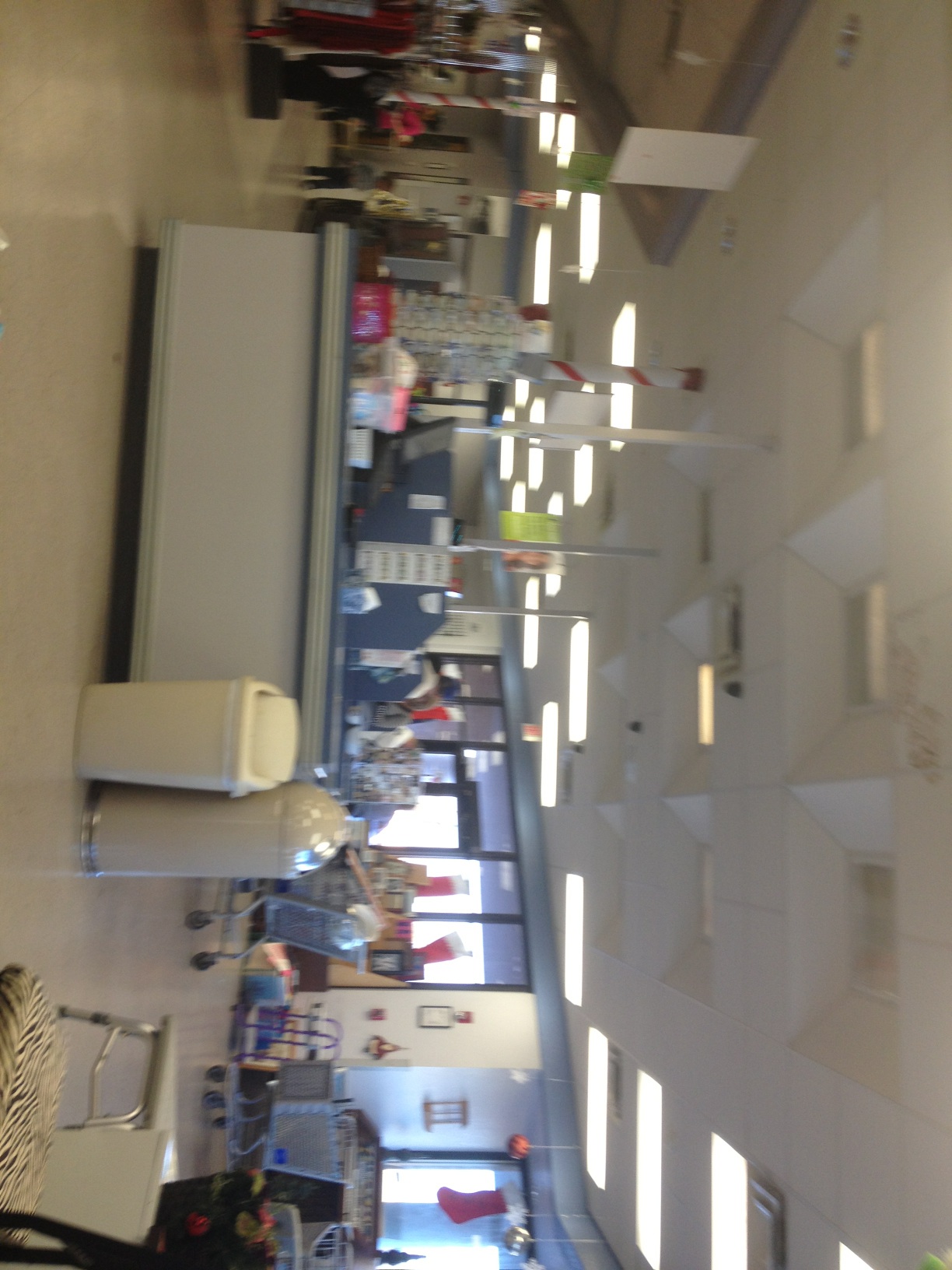 A photo captured by a person who is blind. A computer-generated caption for this photo is: A display that has a bunch of items on it.