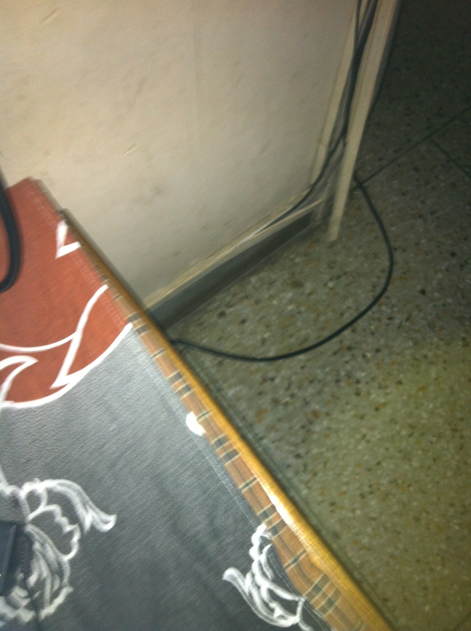A photo captured by a person who is blind. A computer-generated caption for this photo is: A close up of a person on a floor.