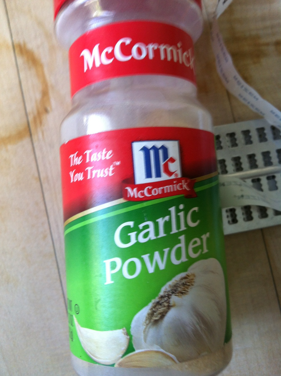 A photo captured by a person who is blind. A computer-generated caption for this photo is: A close up of a bottle of food.