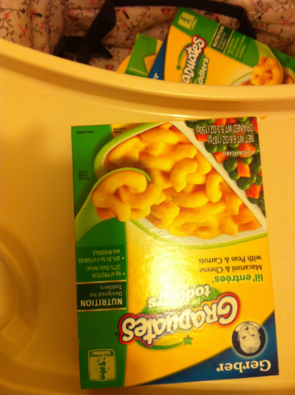 A photo captured by a person who is blind. A computer-generated caption for this photo is: A box of food in a container.