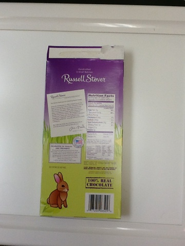 A photo captured by a person who is blind. A computer-generated caption for this photo is: A sign that is sitting on top of a refrigerator.