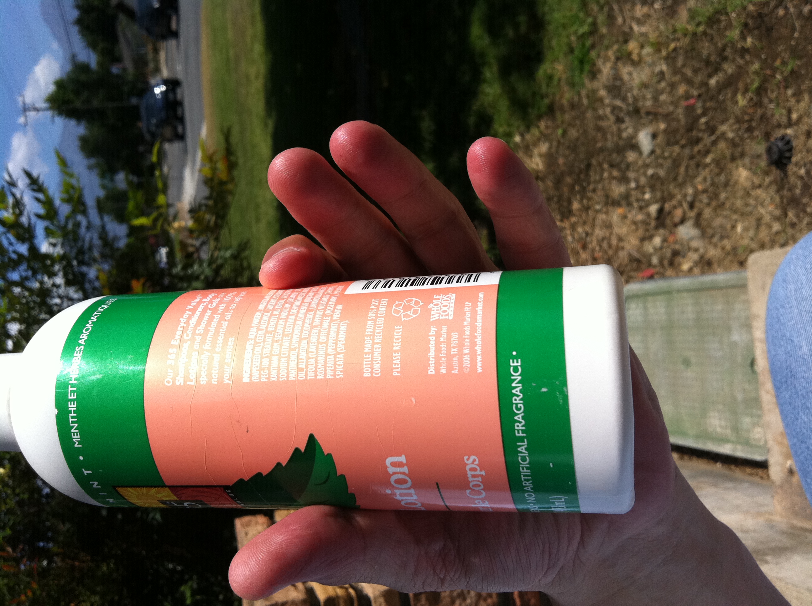 A photo captured by a person who is blind. A computer-generated caption for this photo is: A person is holding a bottle of beer.