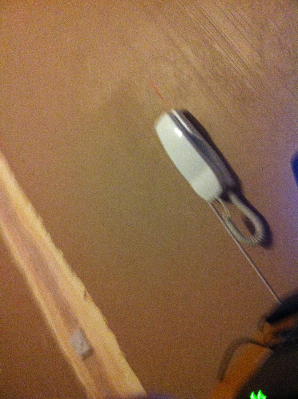 A photo captured by a person who is blind. A computer-generated caption for this photo is: A close up of a toothbrush on a table.