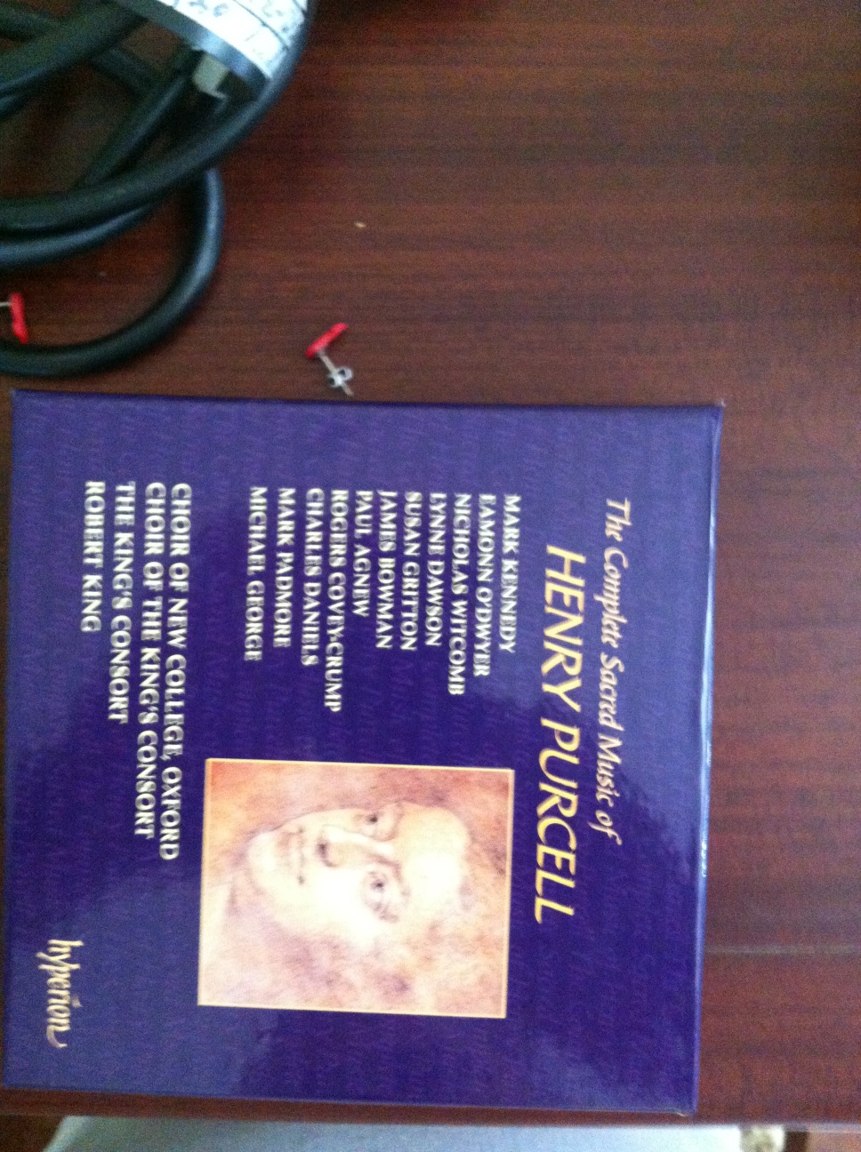 A photo captured by a person who is blind. A computer-generated caption for this photo is: A book that is on the table.