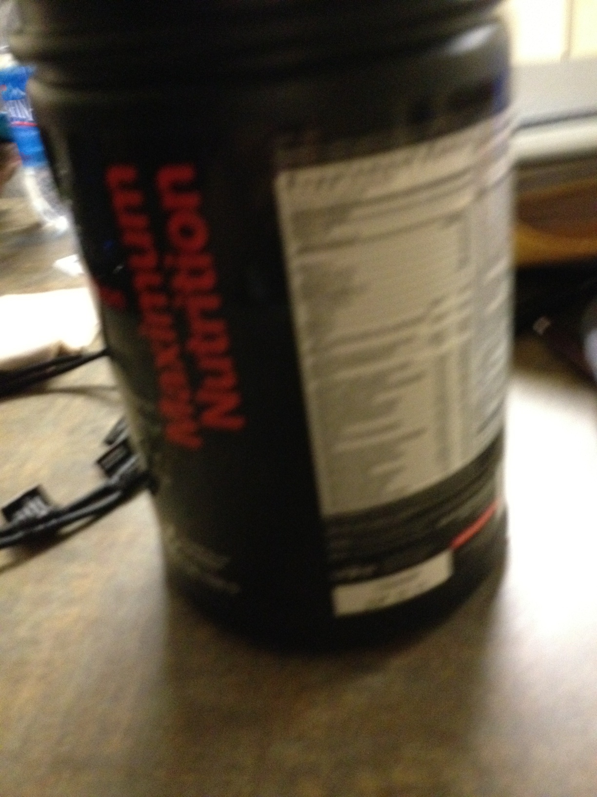 A photo captured by a person who is blind. A computer-generated caption for this photo is: A close up of a black and white cup.