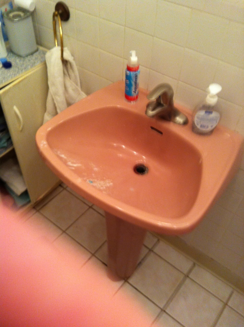 A photo captured by a person who is blind. A computer-generated caption for this photo is: A sink that is sitting in a bathroom.