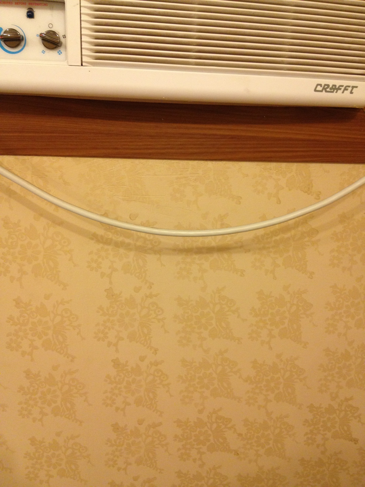 A photo captured by a person who is blind. A computer-generated caption for this photo is: A close up of a window on a wooden table.