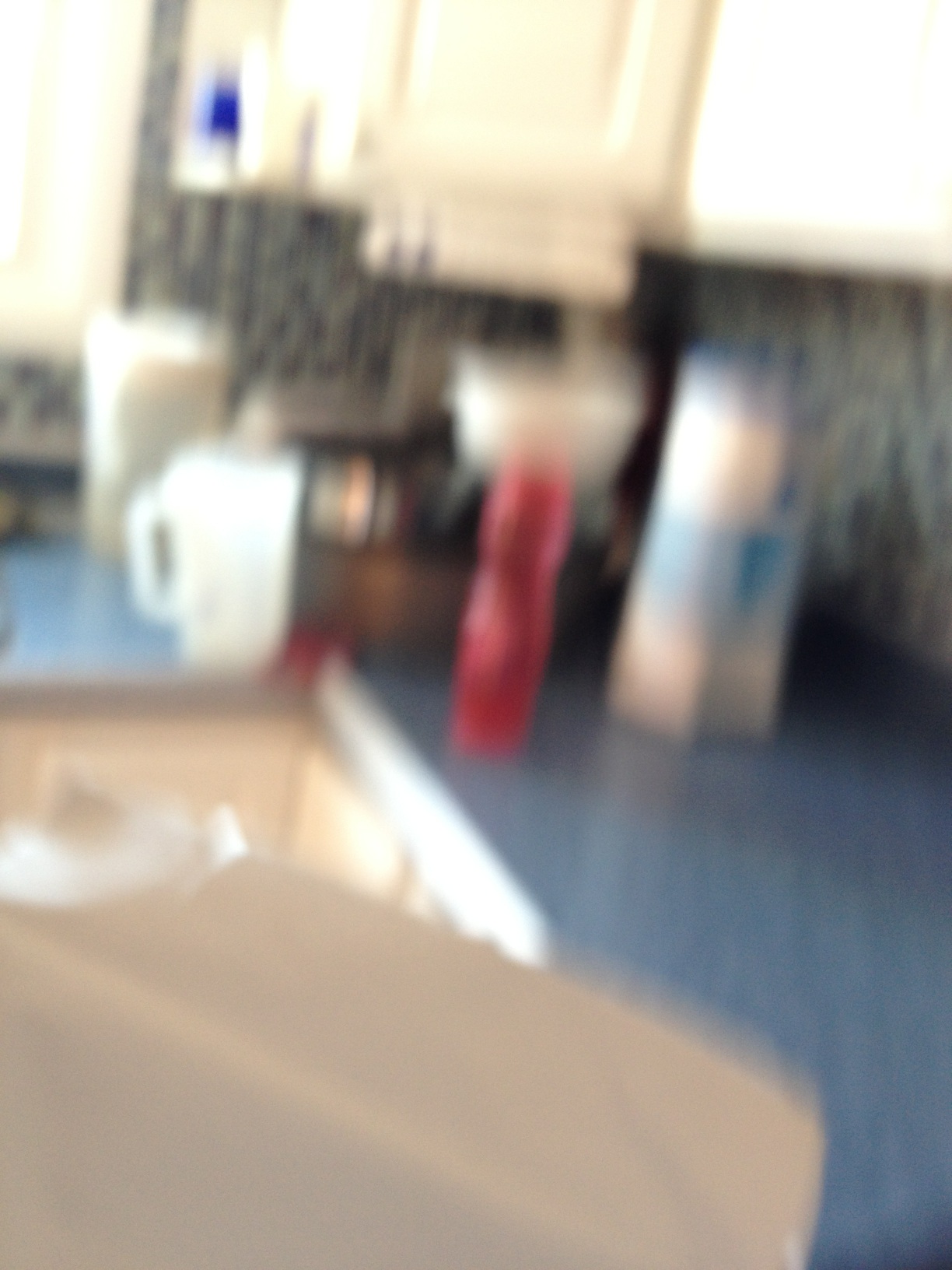 A photo captured by a person who is blind. A computer-generated caption for this photo is: A view of a table in a room.