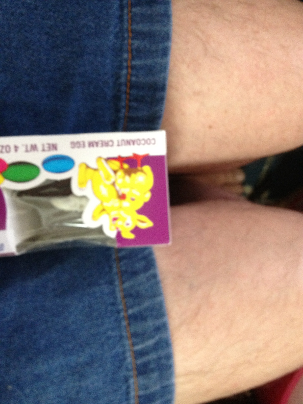 A photo captured by a person who is blind. A computer-generated caption for this photo is: A close up of a person holding a sign.