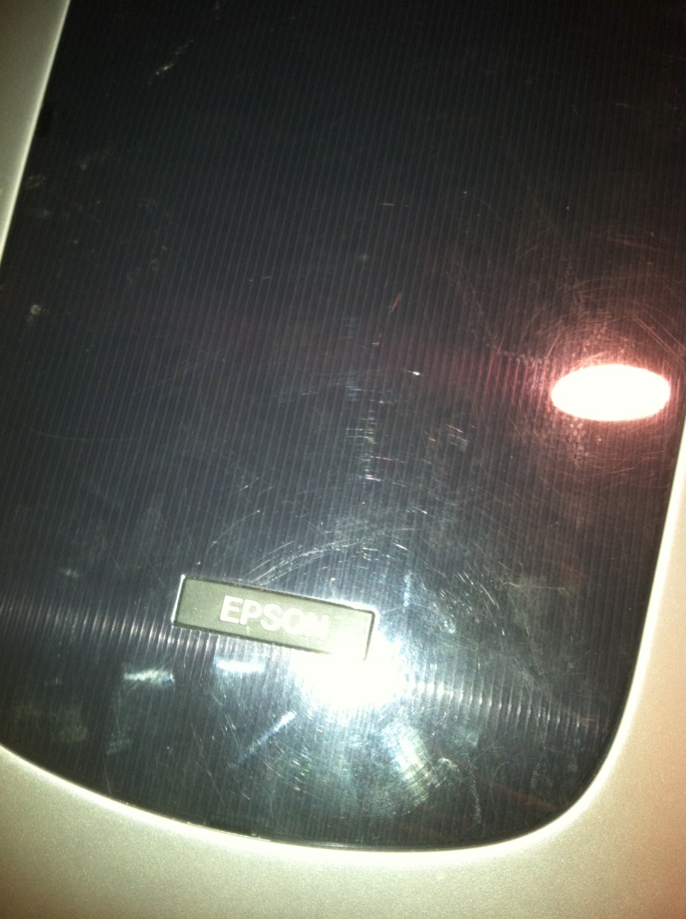 A photo captured by a person who is blind. A computer-generated caption for this photo is: An image of a street sign on a wall.