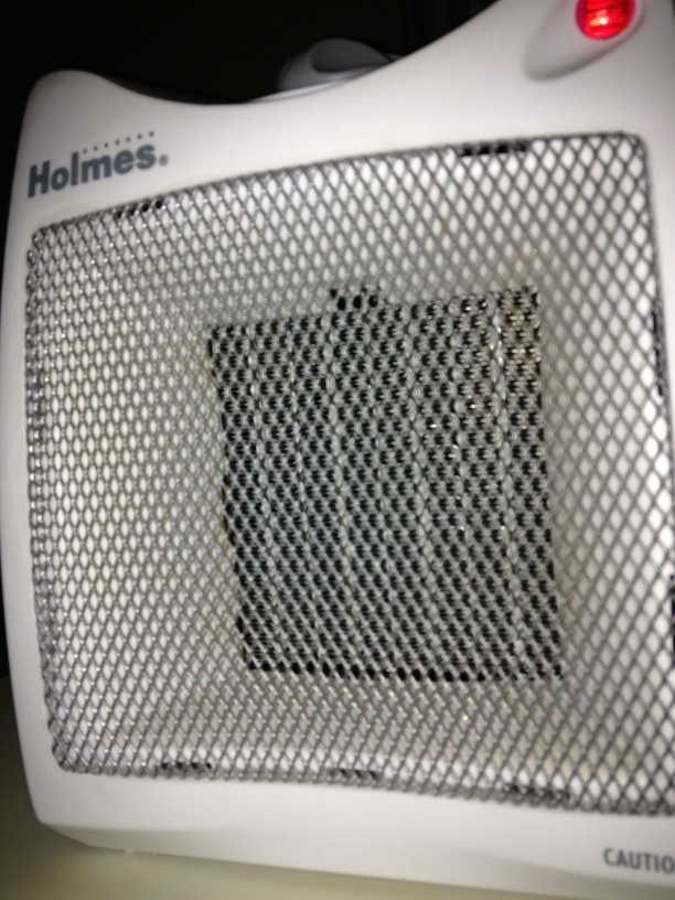 A photo captured by a person who is blind. A computer-generated caption for this photo is: A close up of a white bag on a table.