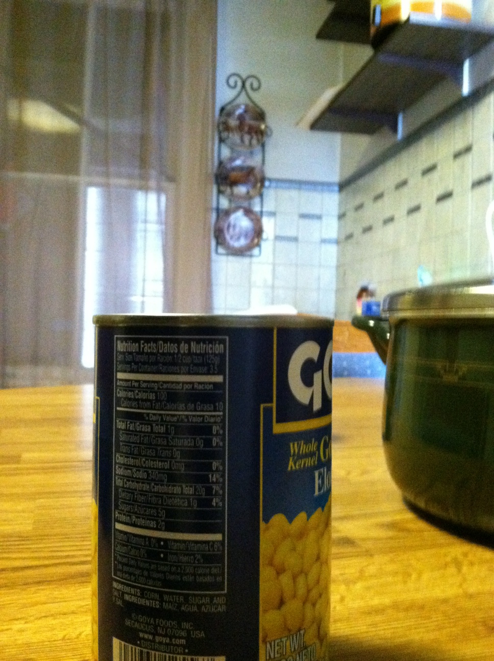 A photo captured by a person who is blind. A computer-generated caption for this photo is: A sign sitting on top of a wooden table.