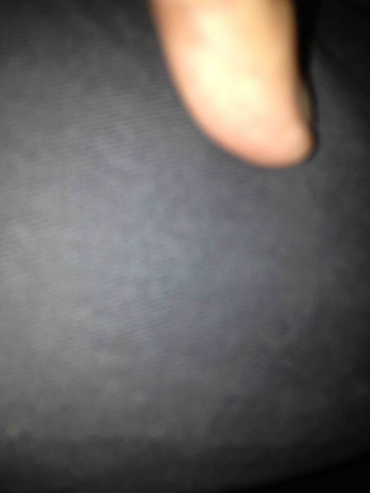A photo captured by a person who is blind. A computer-generated caption for this photo is: A close up of a person holding a light.