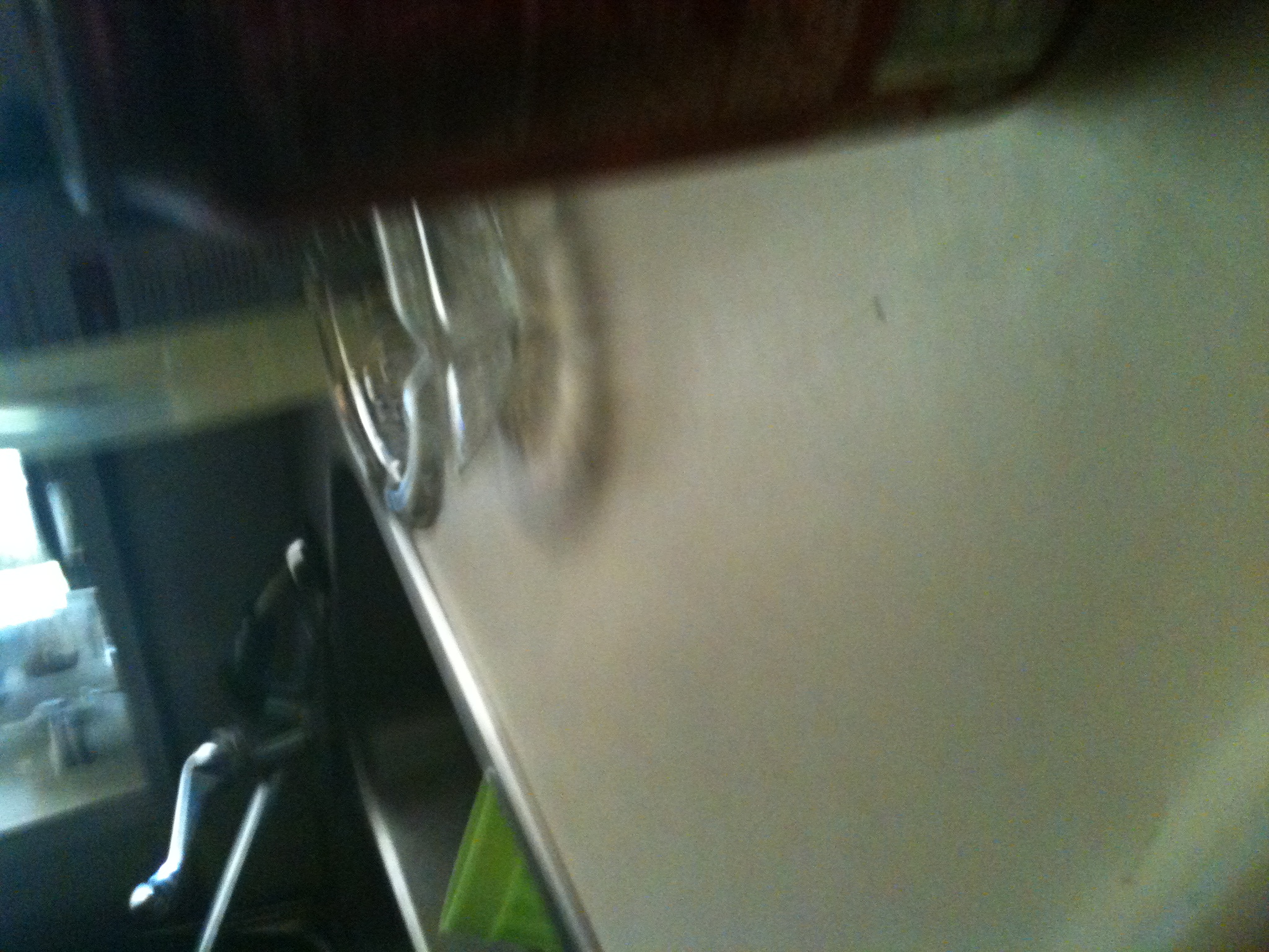A photo captured by a person who is blind. A computer-generated caption for this photo is: A close up of a sink in a mirror.