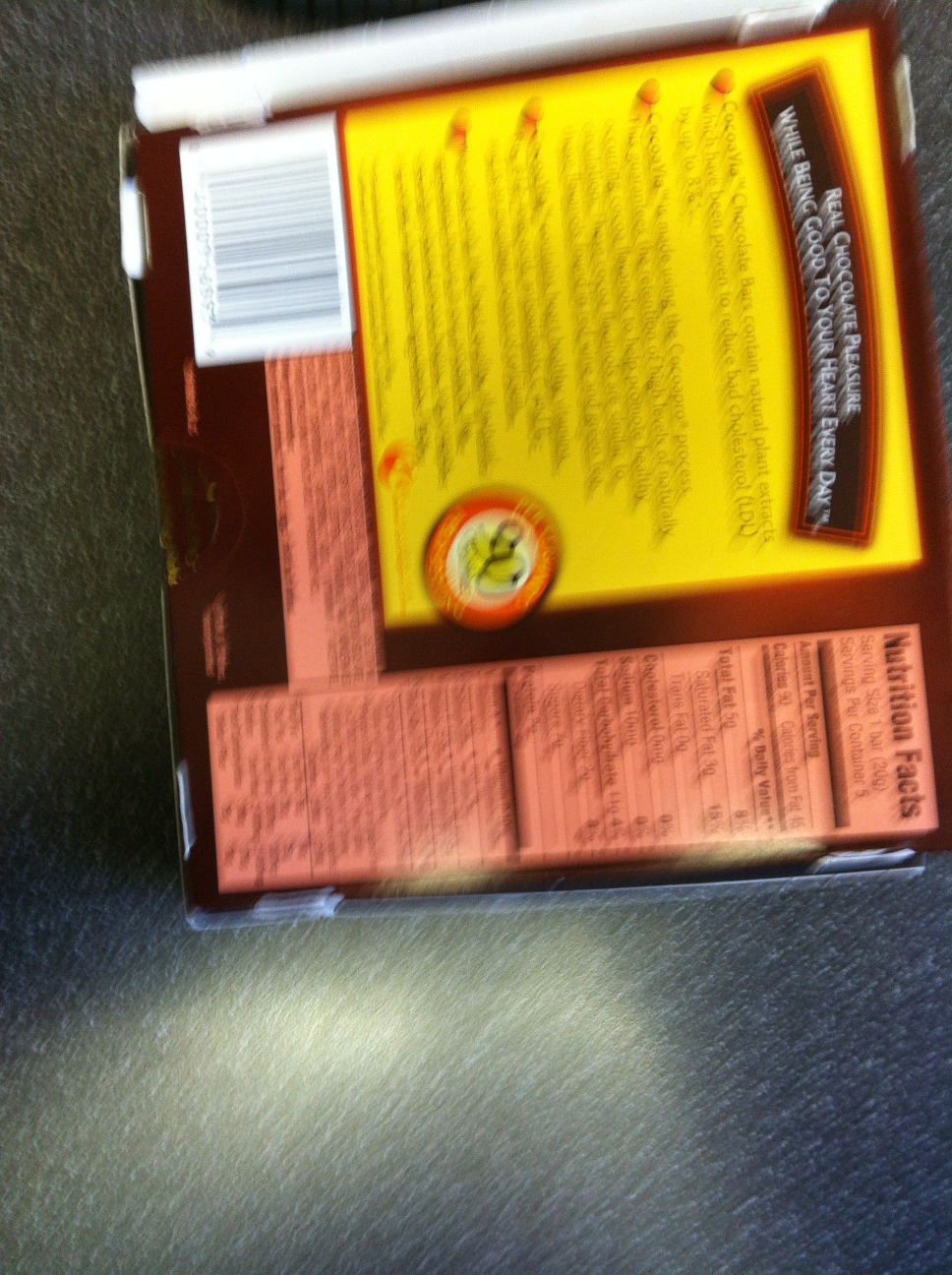 A photo captured by a person who is blind. A computer-generated caption for this photo is: A book sitting on top of a shelf.