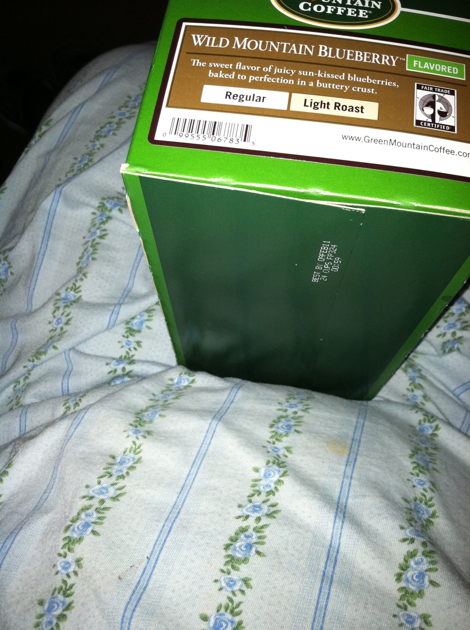 A photo captured by a person who is blind. A computer-generated caption for this photo is: A close up of a book on a bed.