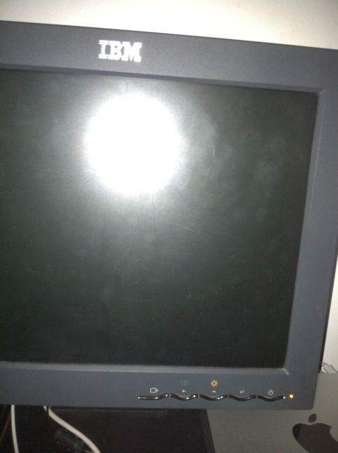 A photo captured by a person who is blind. A computer-generated caption for this photo is: A picture of a television with a light on it.