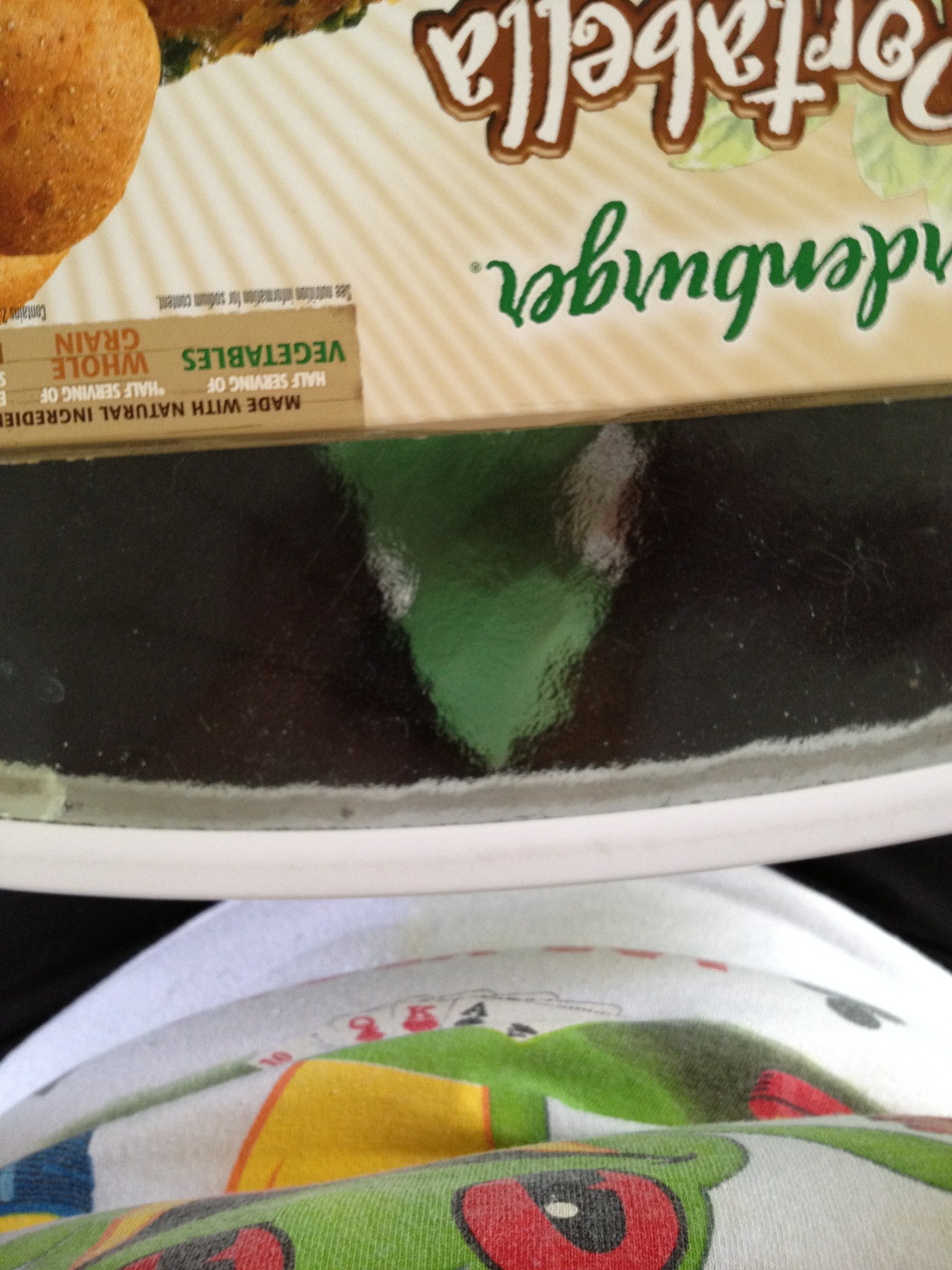 A photo captured by a person who is blind. A computer-generated caption for this photo is: A close up of a cake on a plate.