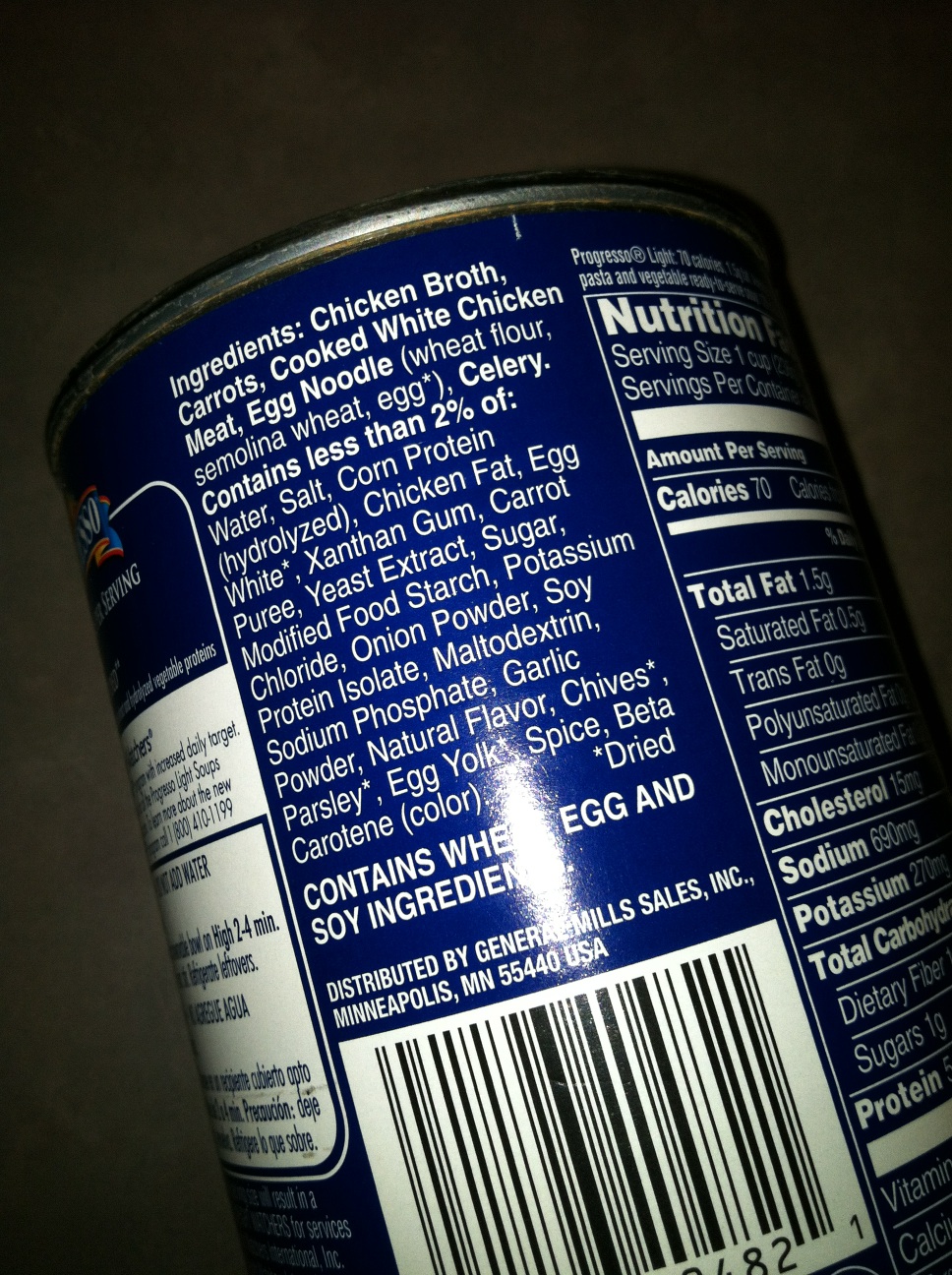 A photo captured by a person who is blind. A computer-generated caption for this photo is: A blue book with an advertisement on it.