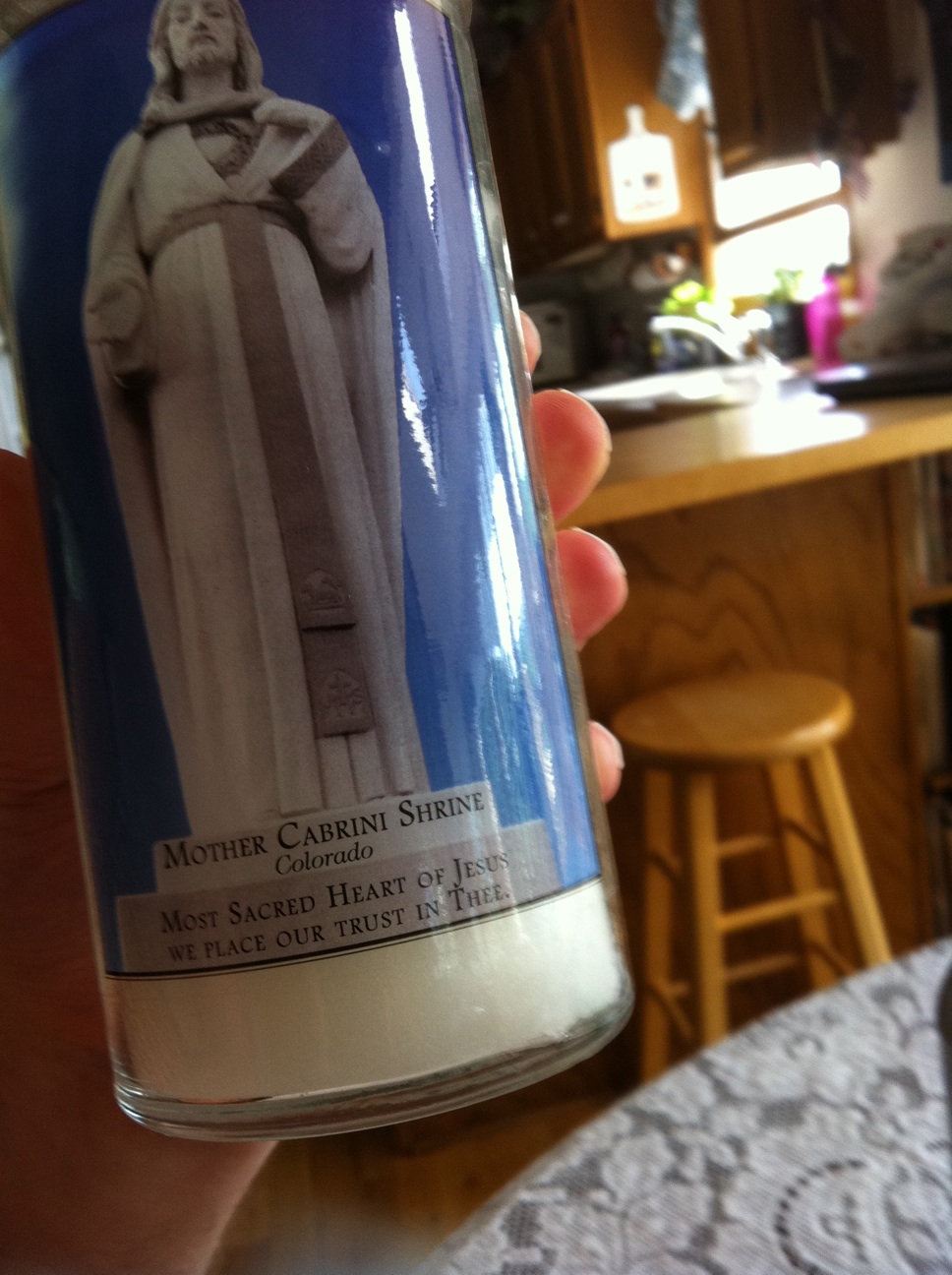 A photo captured by a person who is blind. A computer-generated caption for this photo is: A close up of a person on a table.