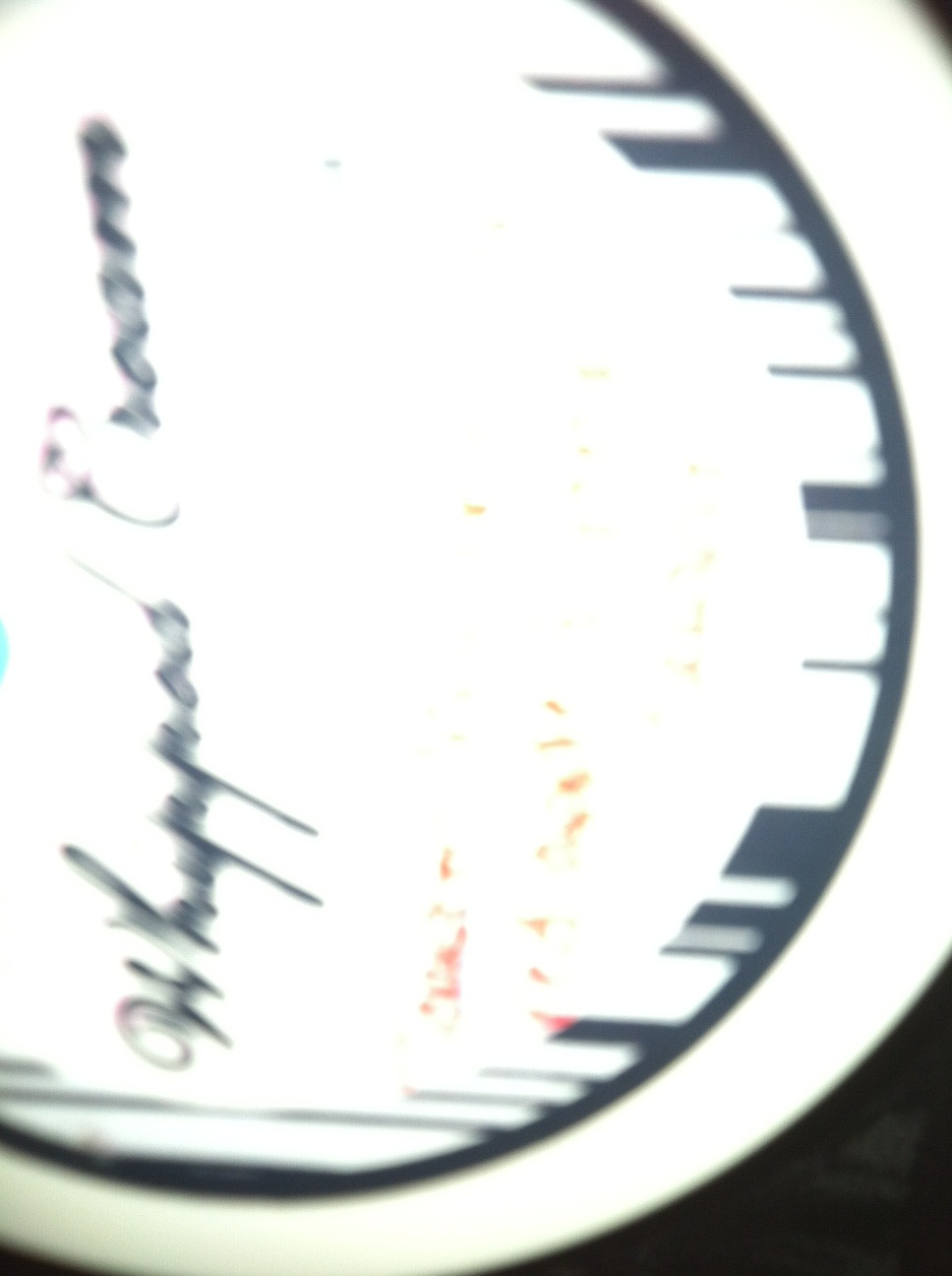 A photo captured by a person who is blind. A computer-generated caption for this photo is: A close up of a window with a light on it.