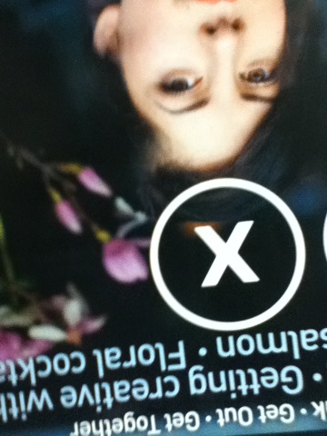 A photo captured by a person who is blind. A computer-generated caption for this photo is: A close up of a person holding a picture.