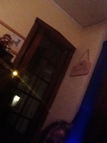 A photo captured by a person who is blind. A computer-generated caption for this photo is: A close up of a person ' s tie.