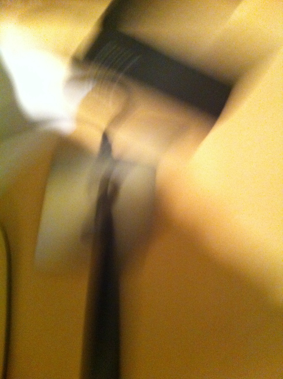 A photo captured by a person who is blind. A computer-generated caption for this photo is: A close up of a person holding a knife.
