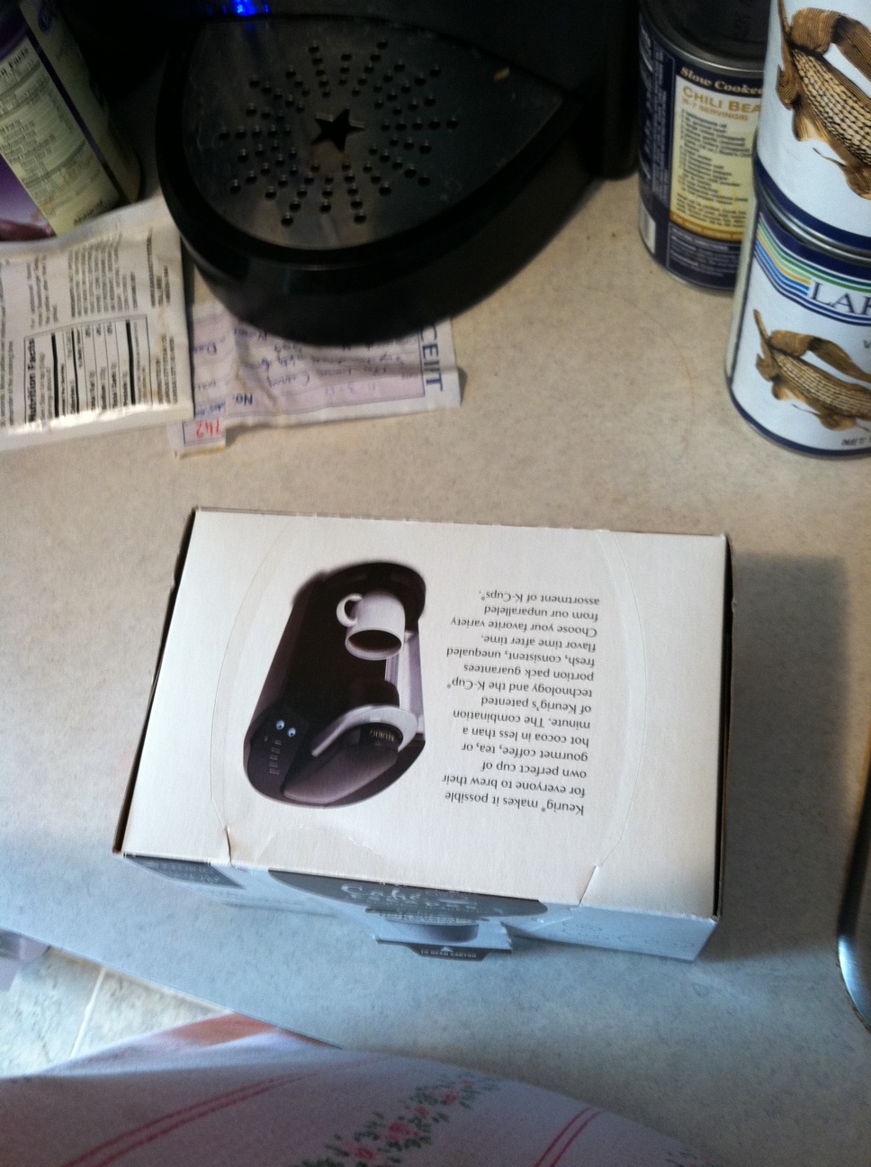A photo captured by a person who is blind. A computer-generated caption for this photo is: A book is sitting on top of a table.