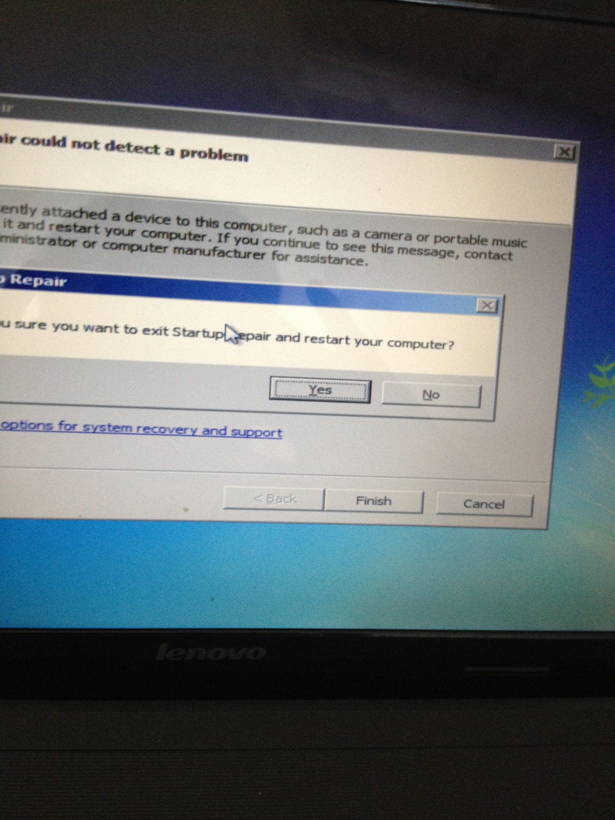 A photo captured by a person who is blind. A computer-generated caption for this photo is: A close up of a laptop on a table.