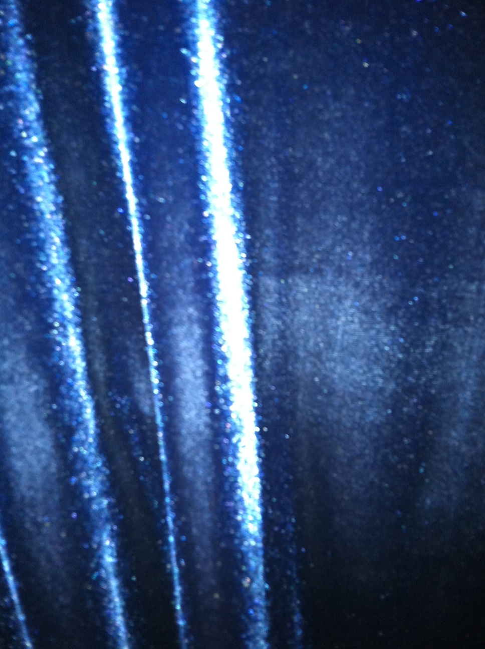 A photo captured by a person who is blind. A computer-generated caption for this photo is: A close up of a tall and white light.