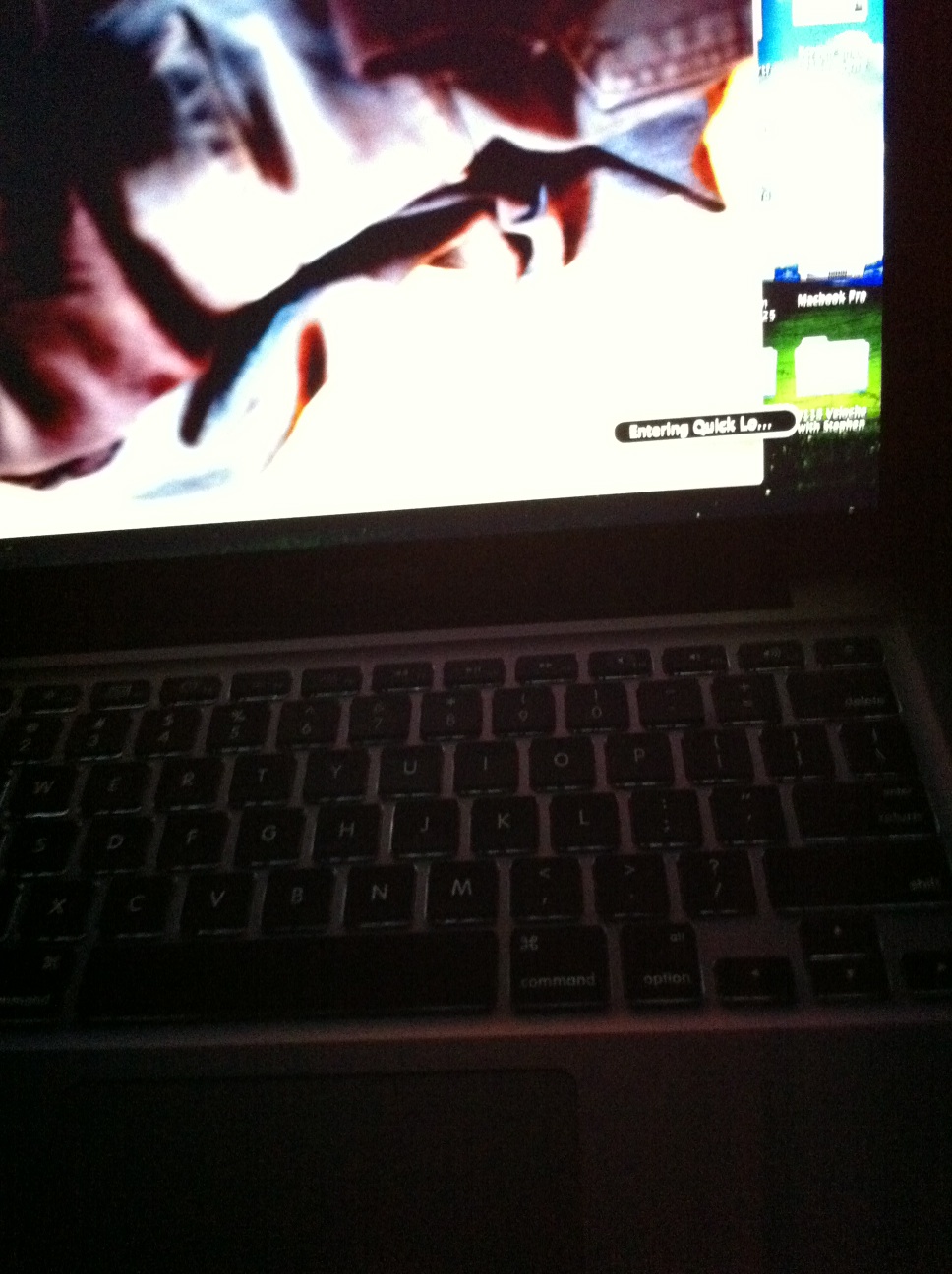 A photo captured by a person who is blind. A computer-generated caption for this photo is: A close up of a laptop on a desk.