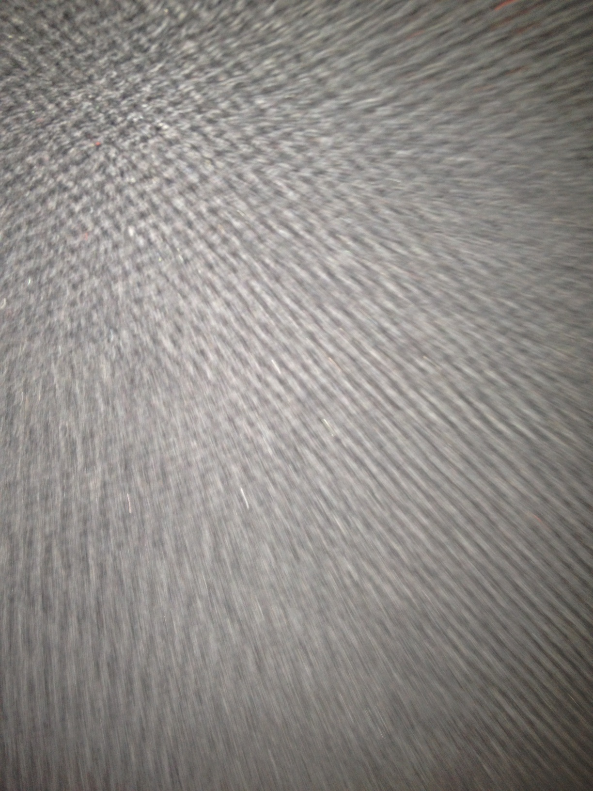 A photo captured by a person who is blind. A computer-generated caption for this photo is: A close up of a person on a white surface.