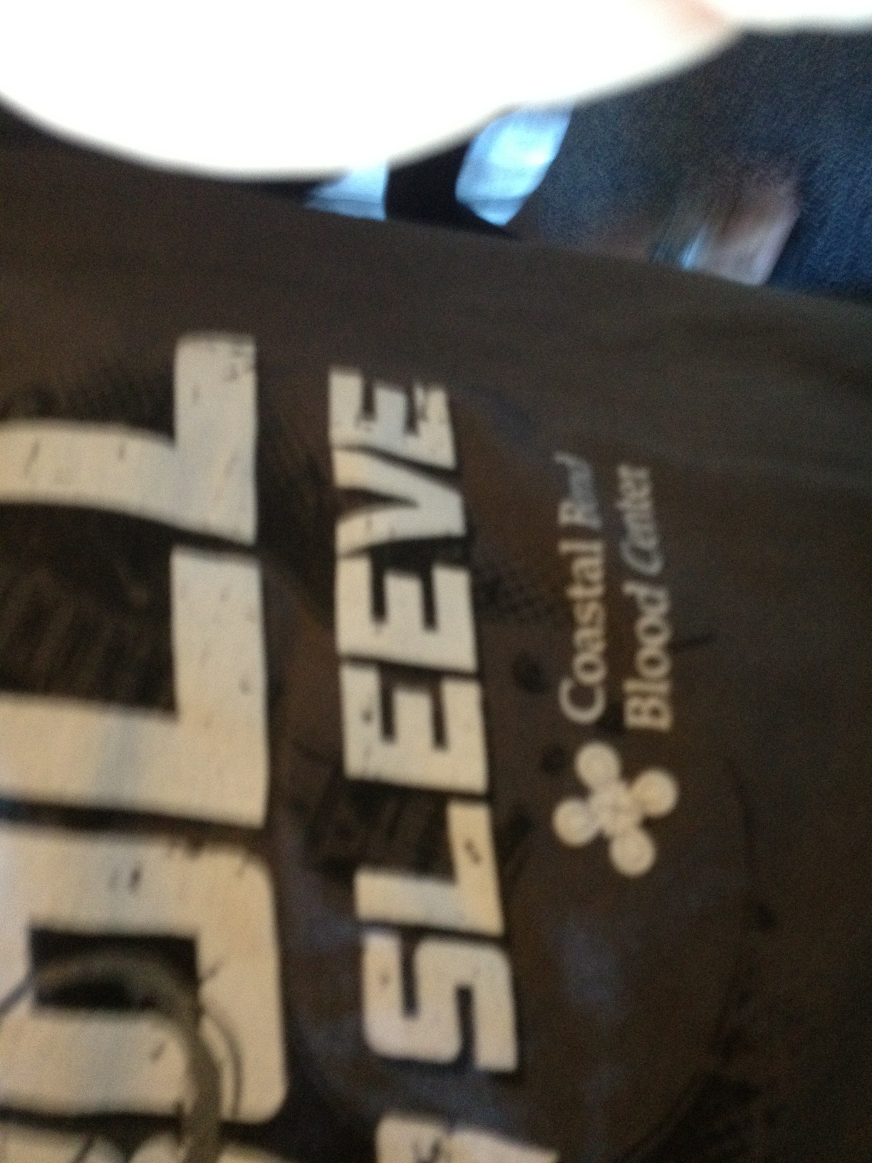 A photo captured by a person who is blind. A computer-generated caption for this photo is: A close up of a sign with a clock on it.